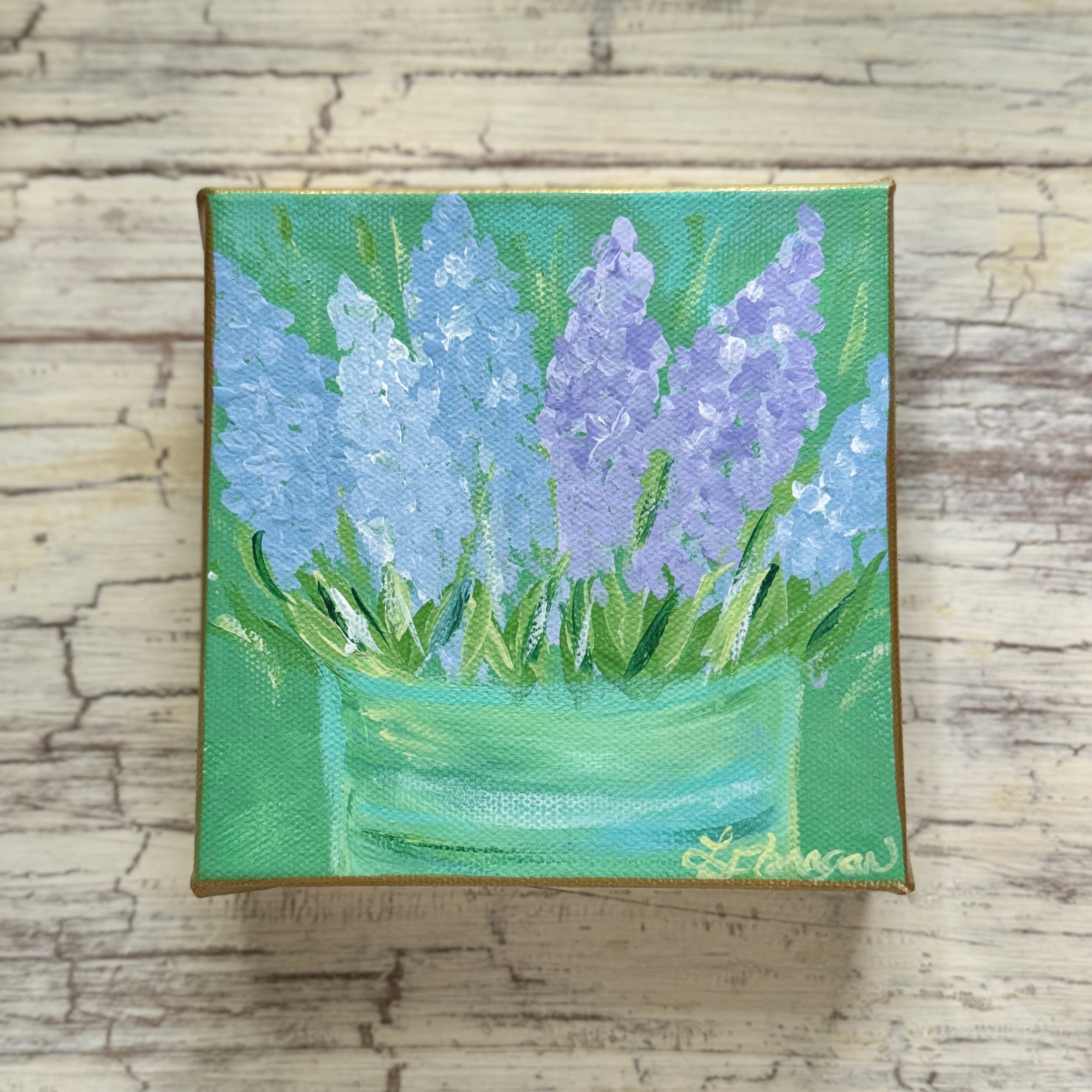Purple Muscari Spring Flowers in Green Tin Vase