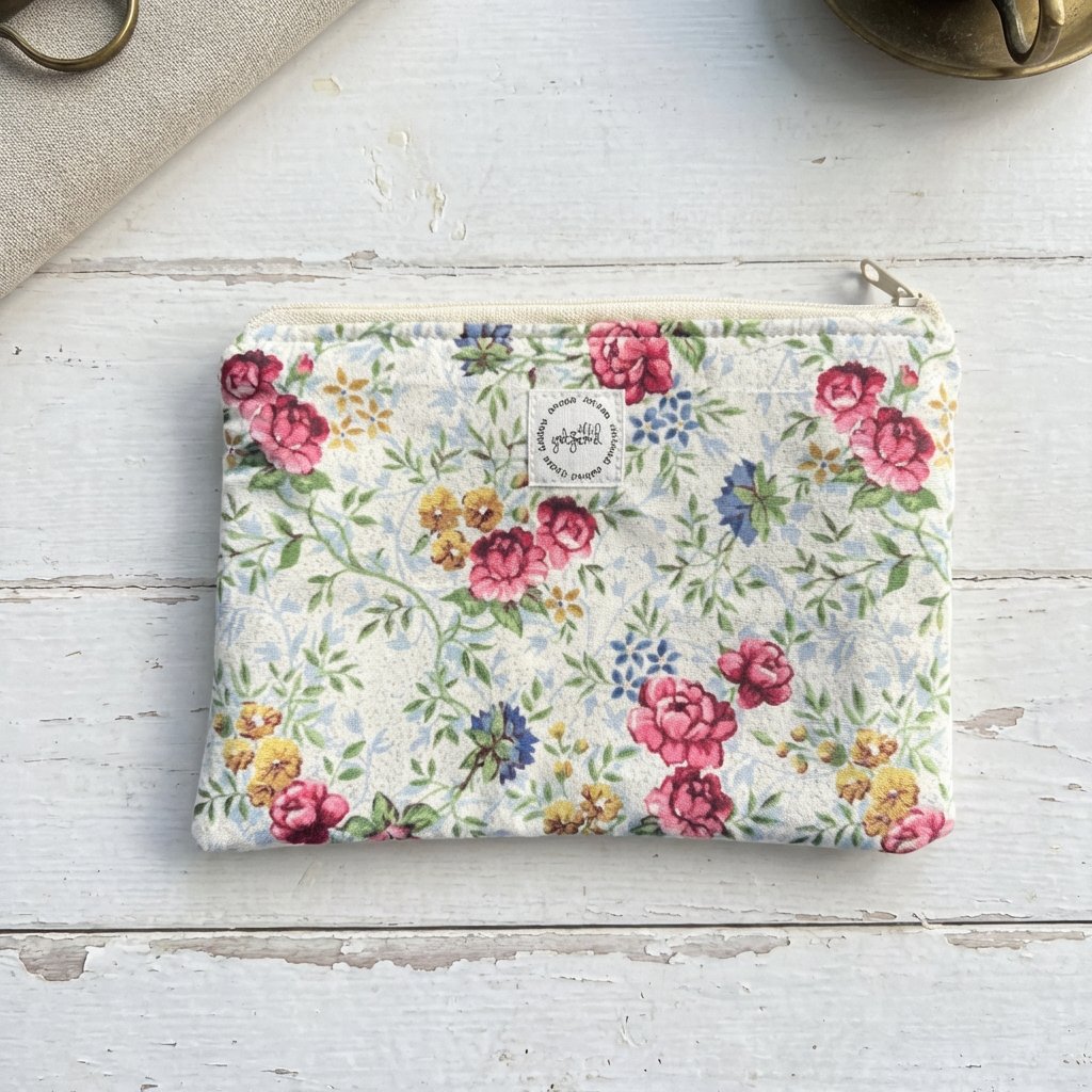 6813756fc324346626b37929_blue-flowered-pouch3_1773721510215.jpeg