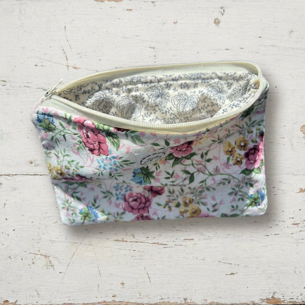 6813756fc324346626b37929_pink-flowered-pouch1_1773721791707.jpeg