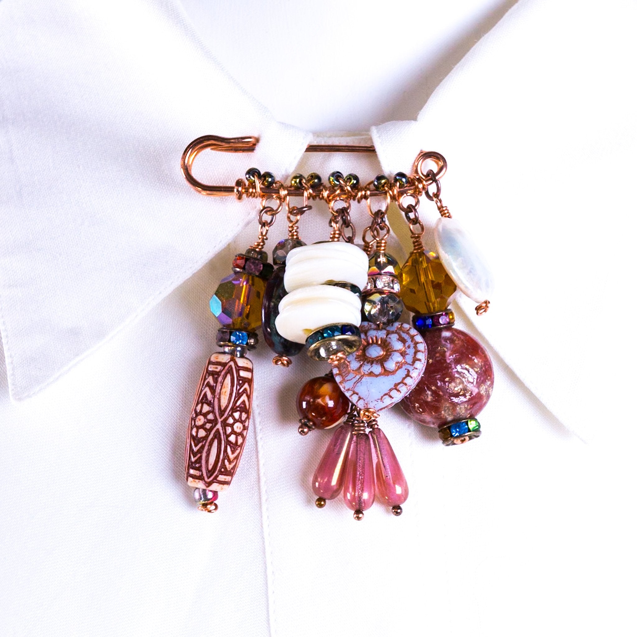 6813756fc324346626b37929_short-stories-charm-brooch-copper-multi-front_1758133813660.jpg